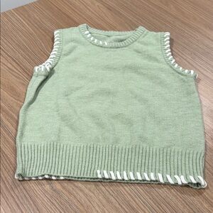 New without tags light green sweater vest with white accents size small